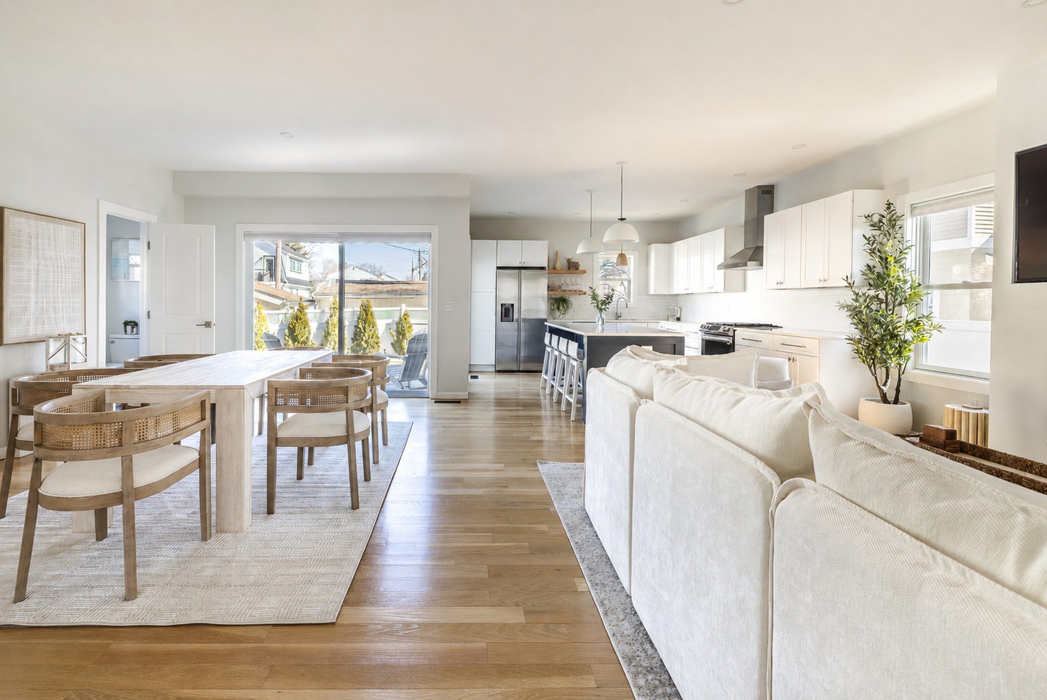 Open-plan living, dining, and kitchen area on the main level.